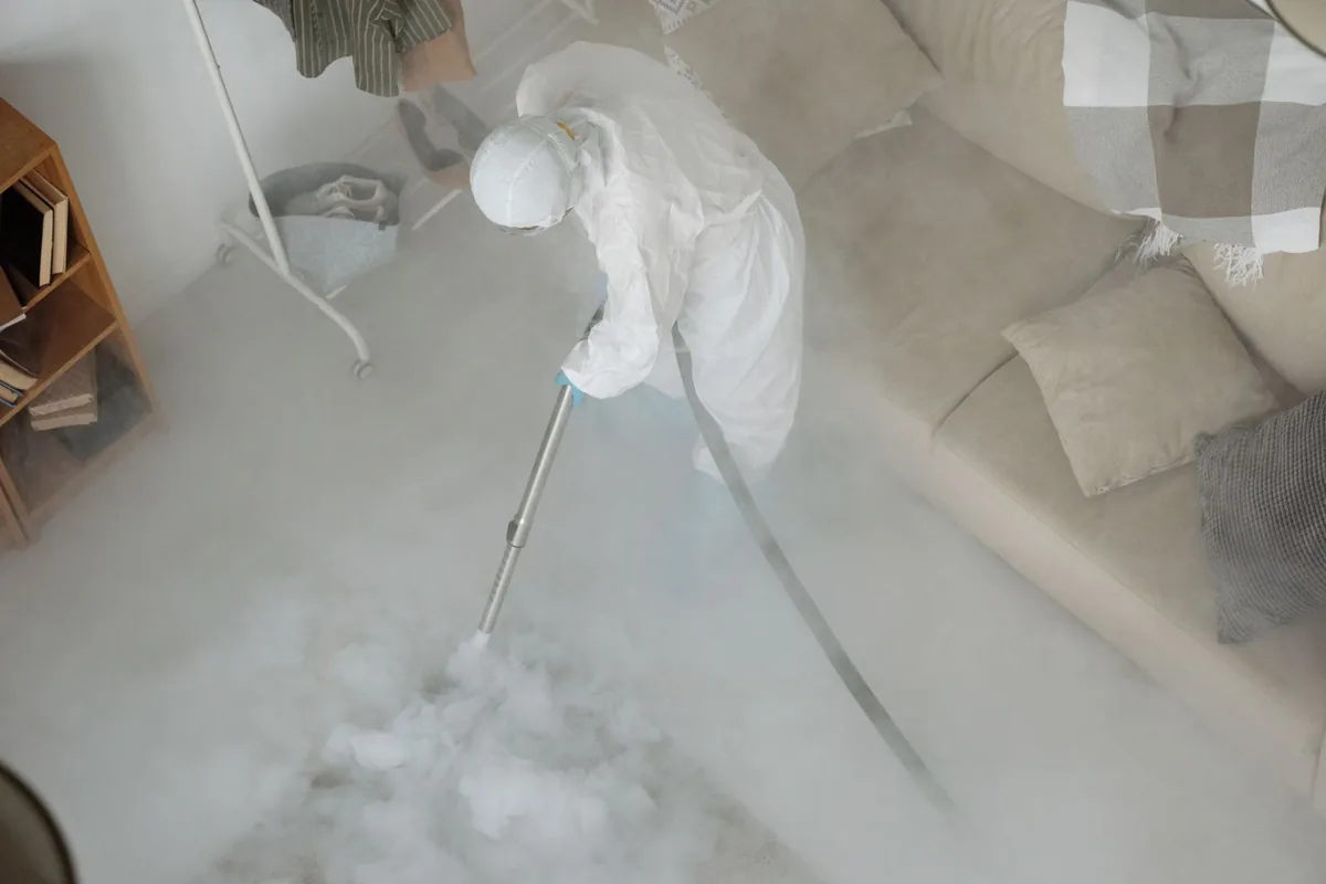 Biohazard cleanup technician in protective equipment, Mound, MN